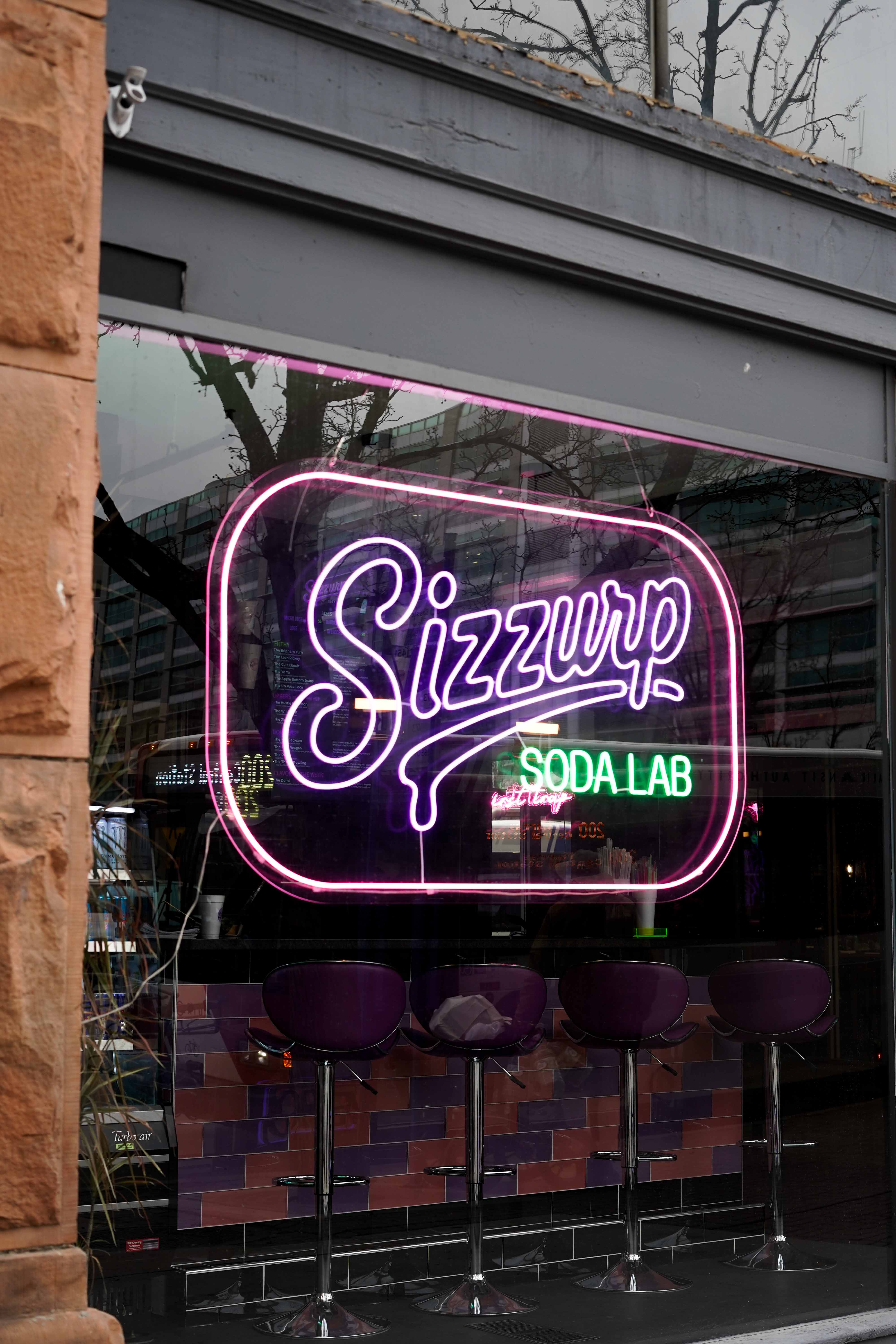 Sizzurp Soda Lab custom dirty soda with colorful syrup layers