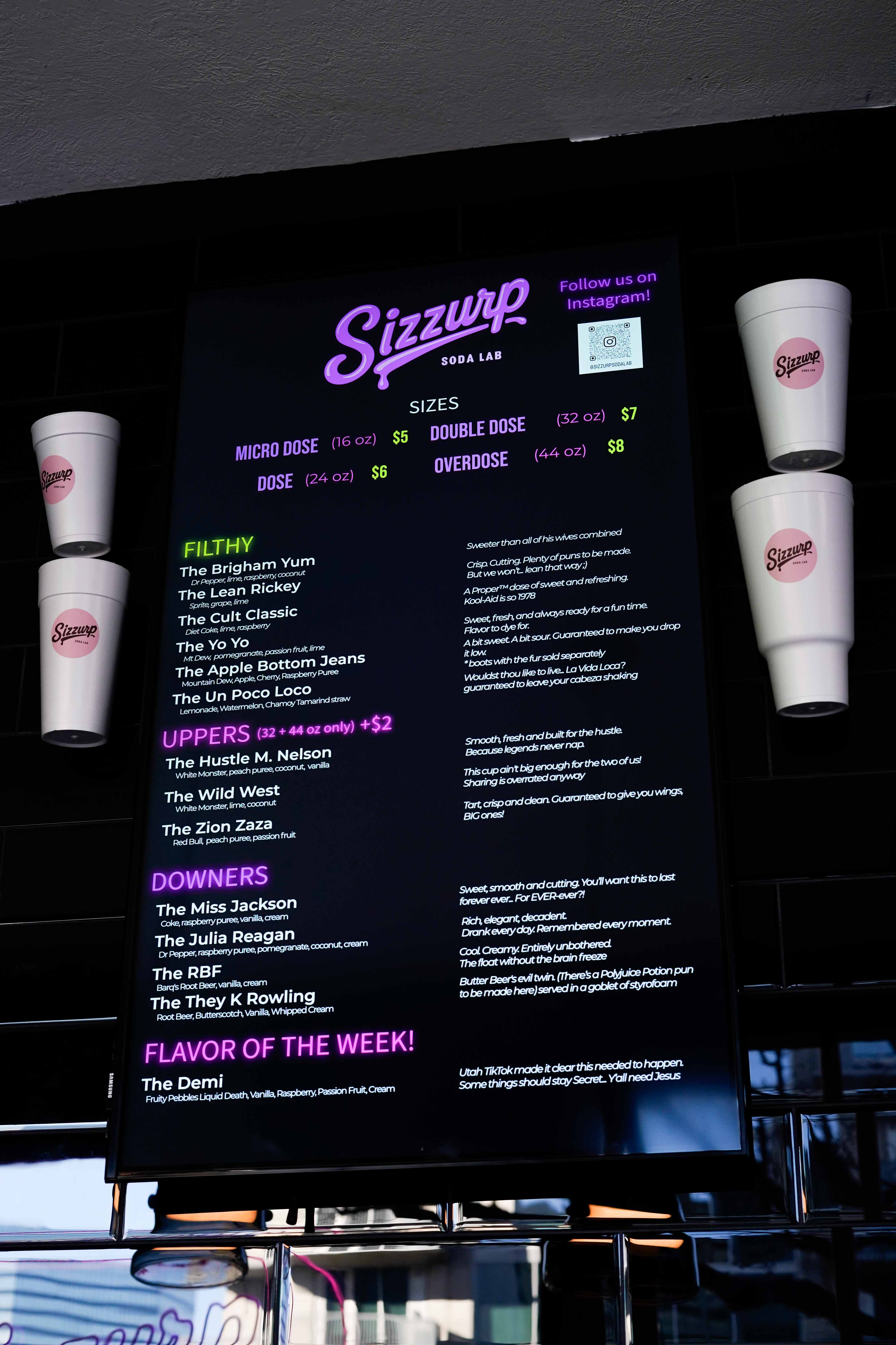 Sizzurp Soda Lab event setup showing the full service counter with colorful custom dirty sodas ready for guests